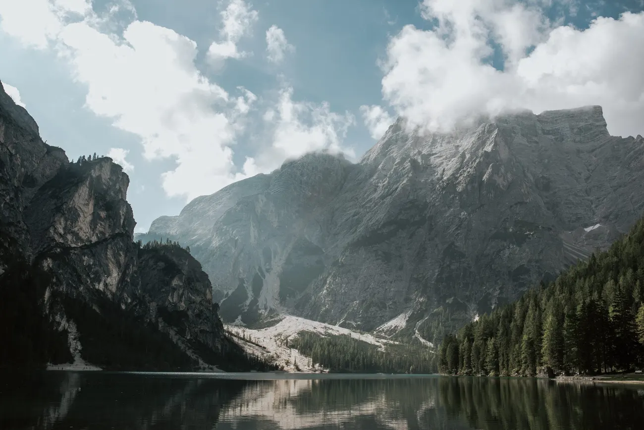 The turquoise water and peaks of Lago di Braies in the Dolomites
