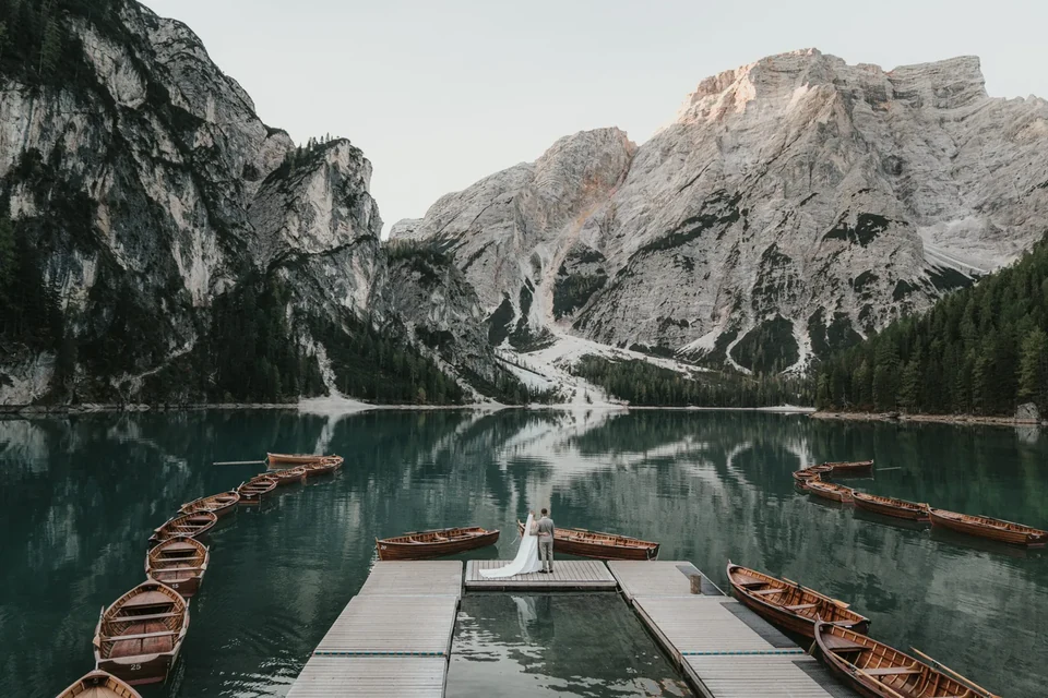 The moored wooden boats and their perfect reflection at Braies