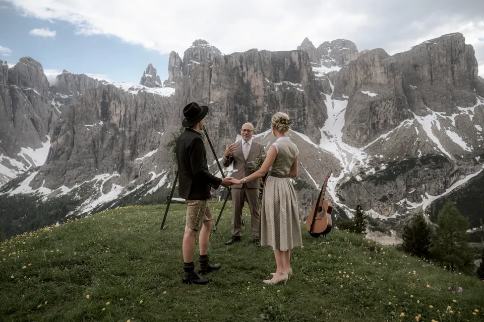 A small ceremony on the meadow beneath the walls of the Sella group