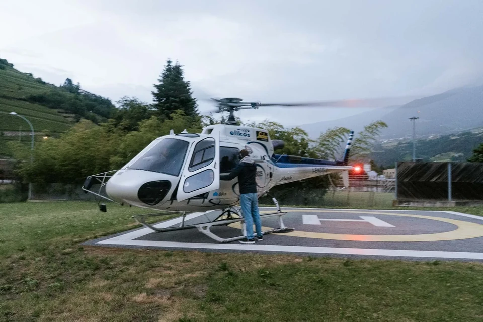The helicopter waiting on the valley helipad