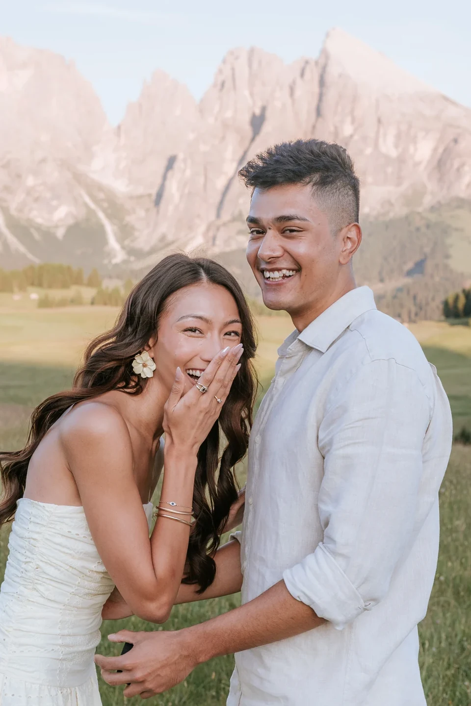 Hands to her face in the first second of surprise