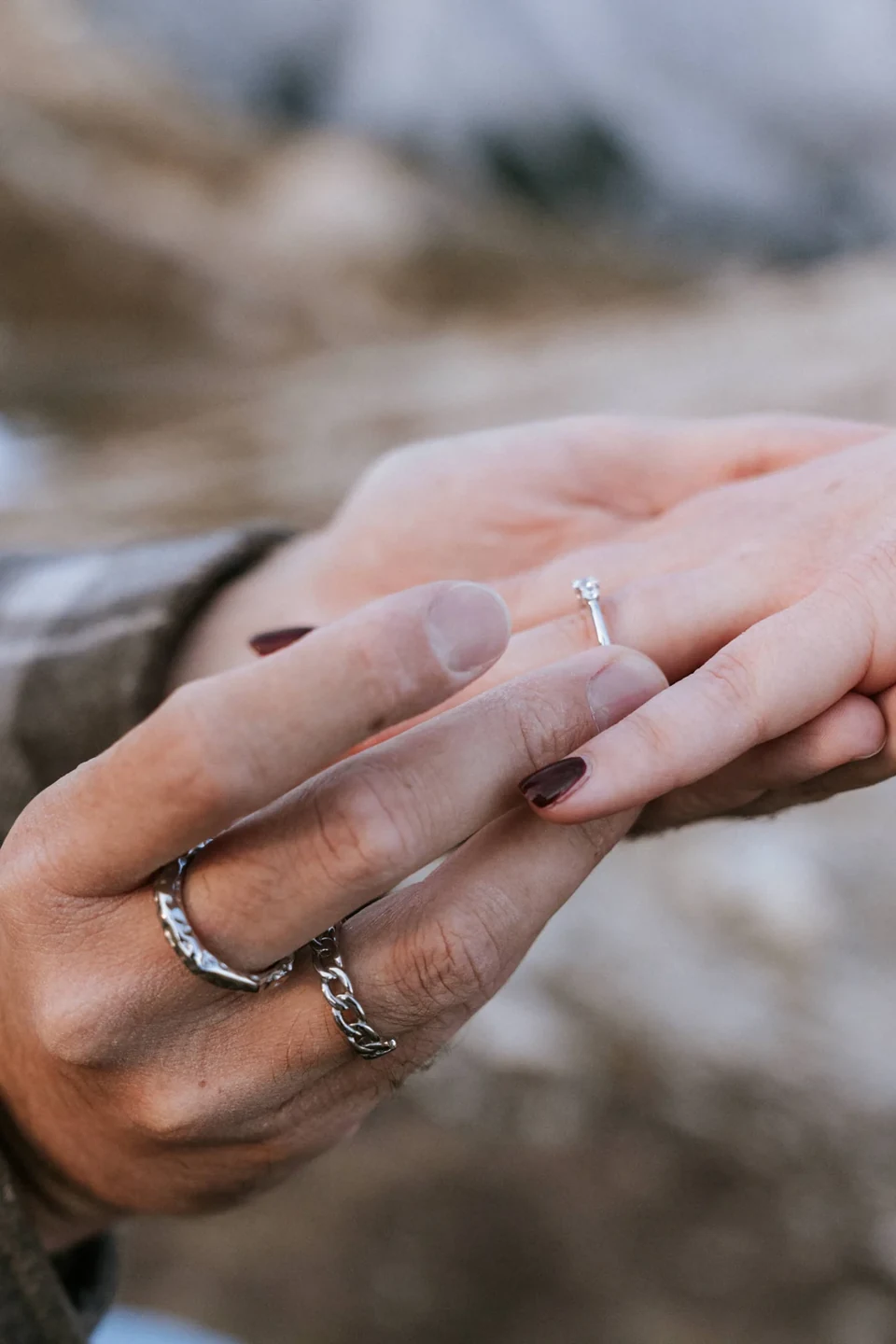 A close-up of the new engagement ring in warm light