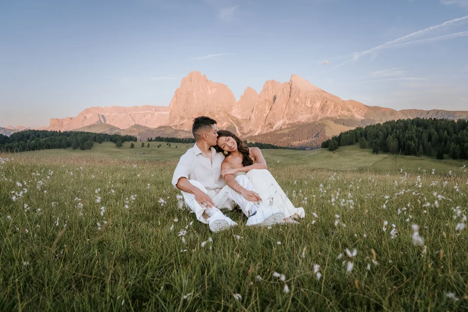 Sitting together in the cotton grass as the peaks glow at last light